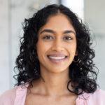 Smiling woman with pink shirt