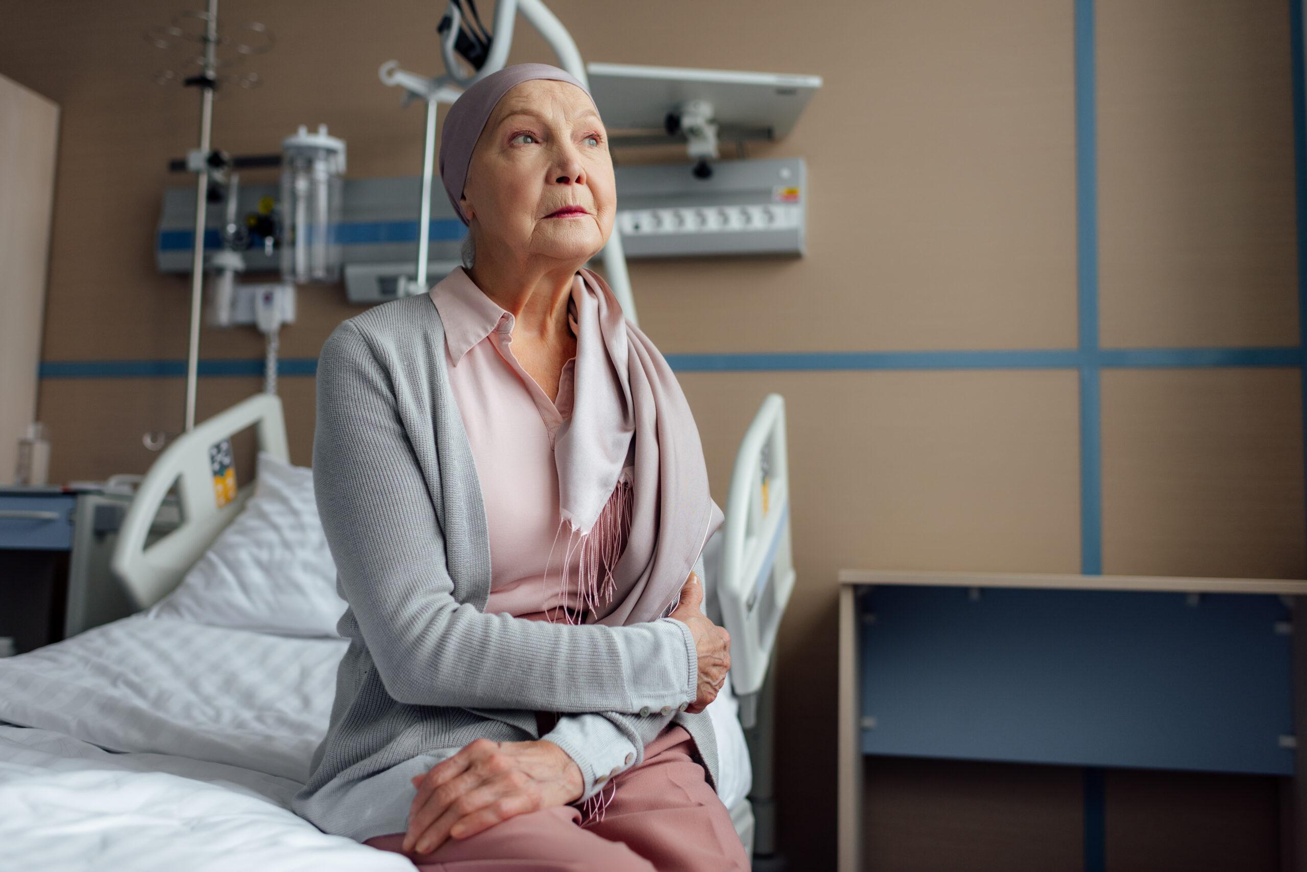 Elderly woman sitting in hospital