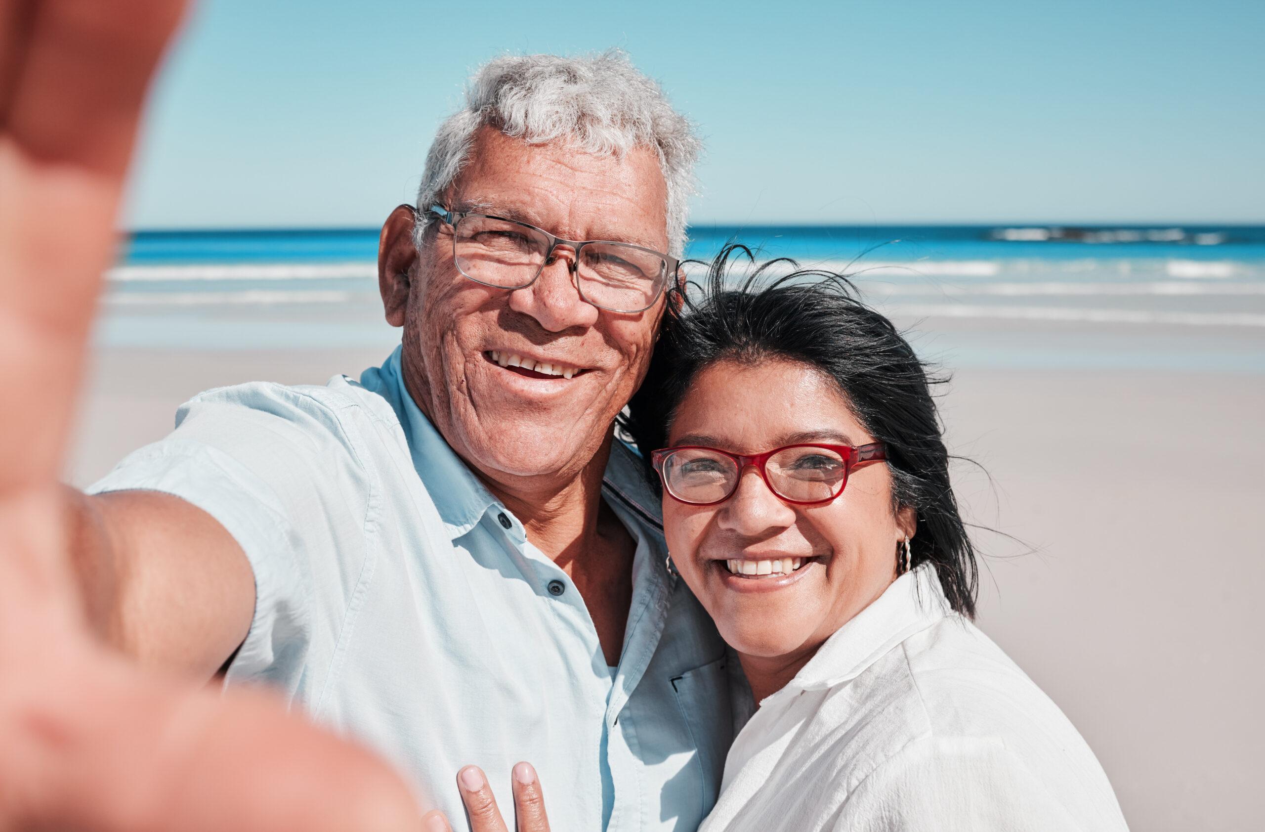 Elderly couple at a beach for travel.