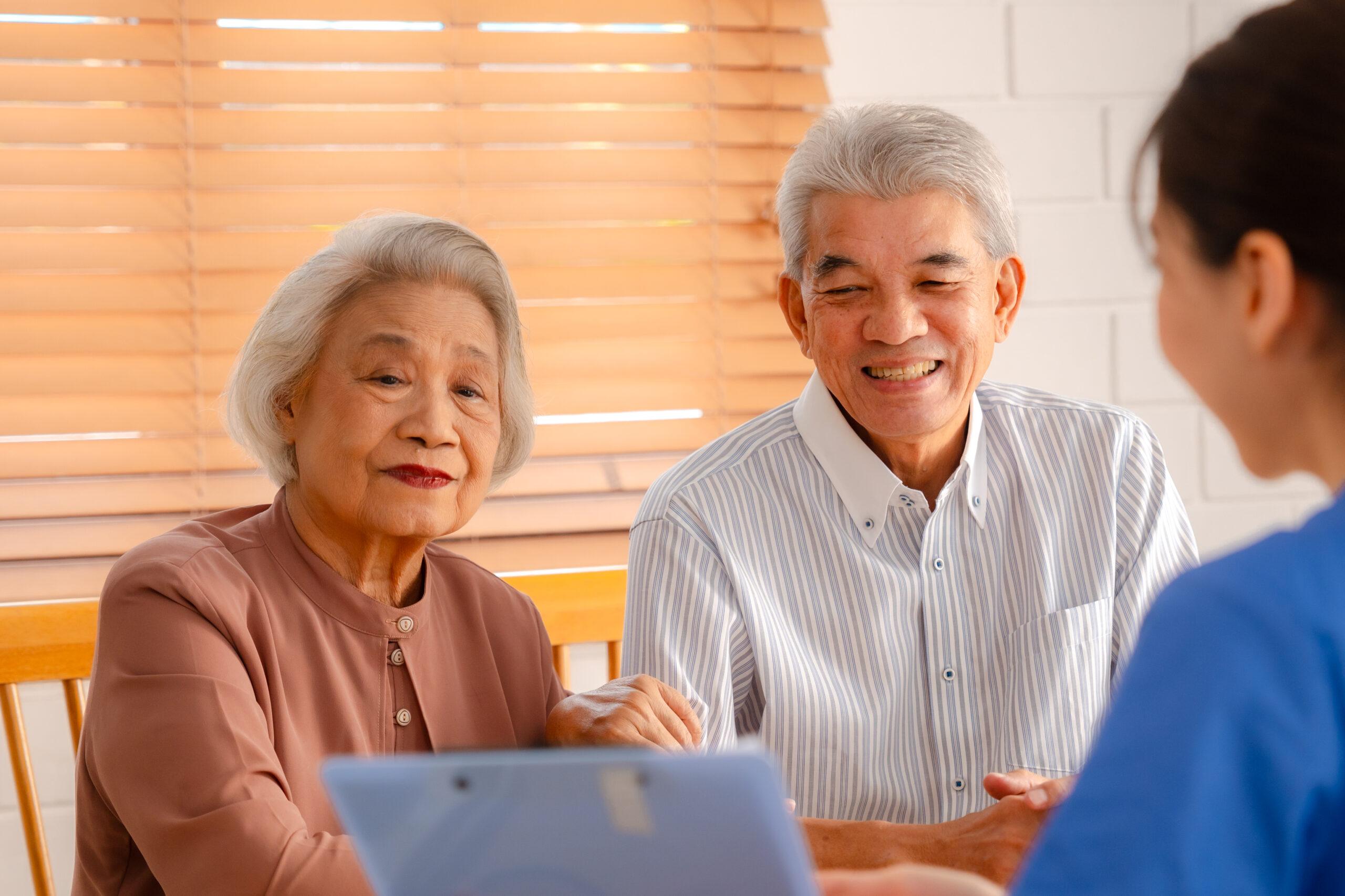 Elderly couple discusses insurance options