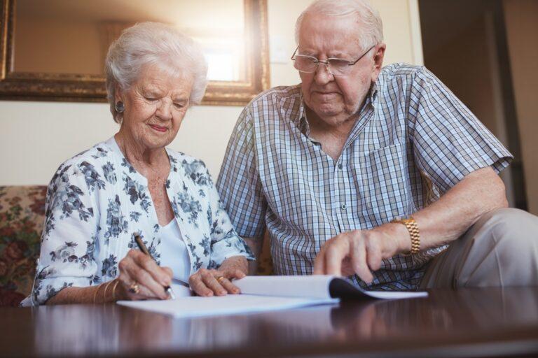 Senior couple doing retirement paperwork
