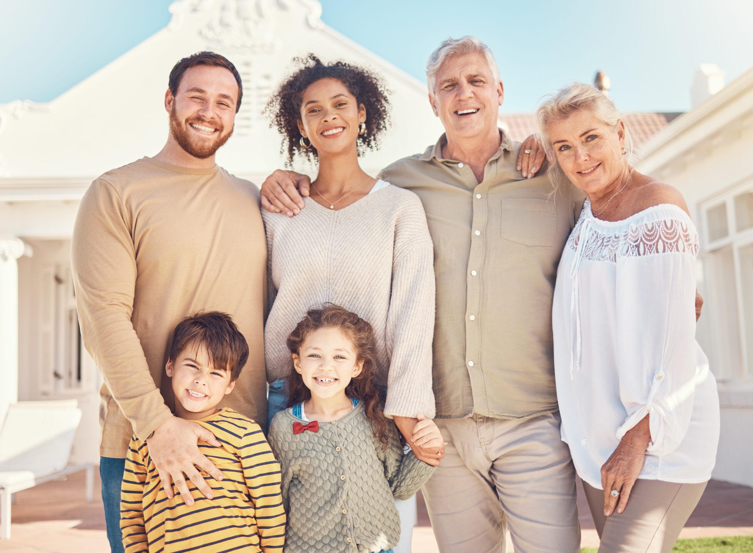 Happy family standing outside