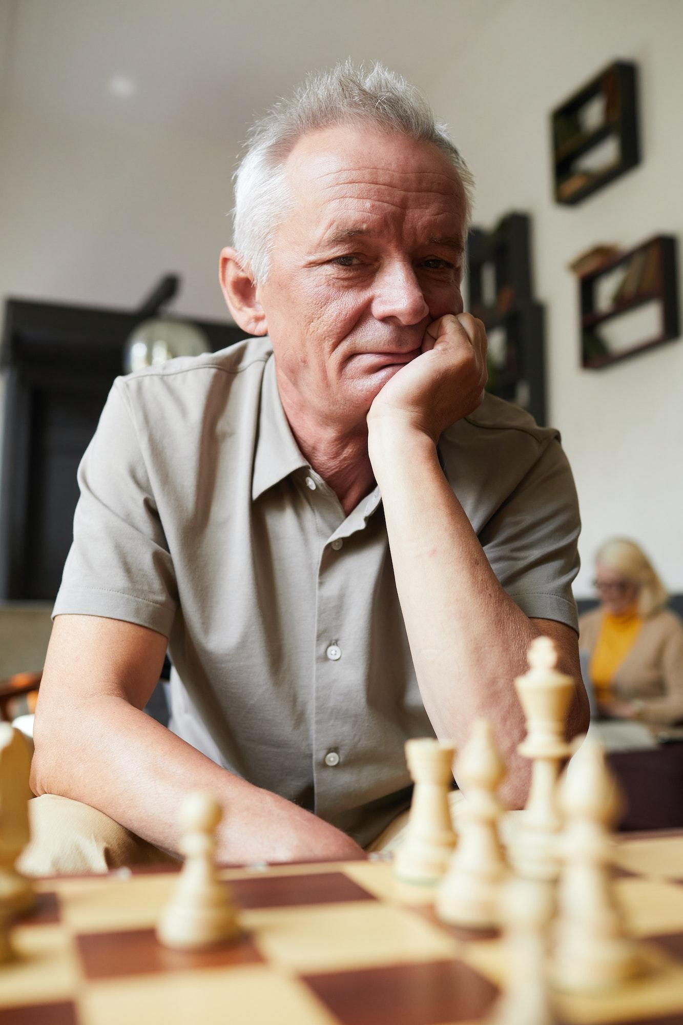 White Haired Senior Man Playing Chess