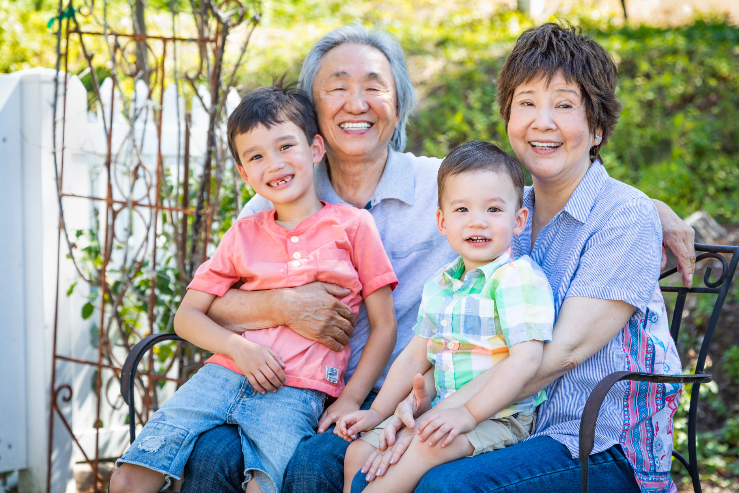 Happy family sitting on bench