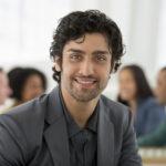 Man smiling in office