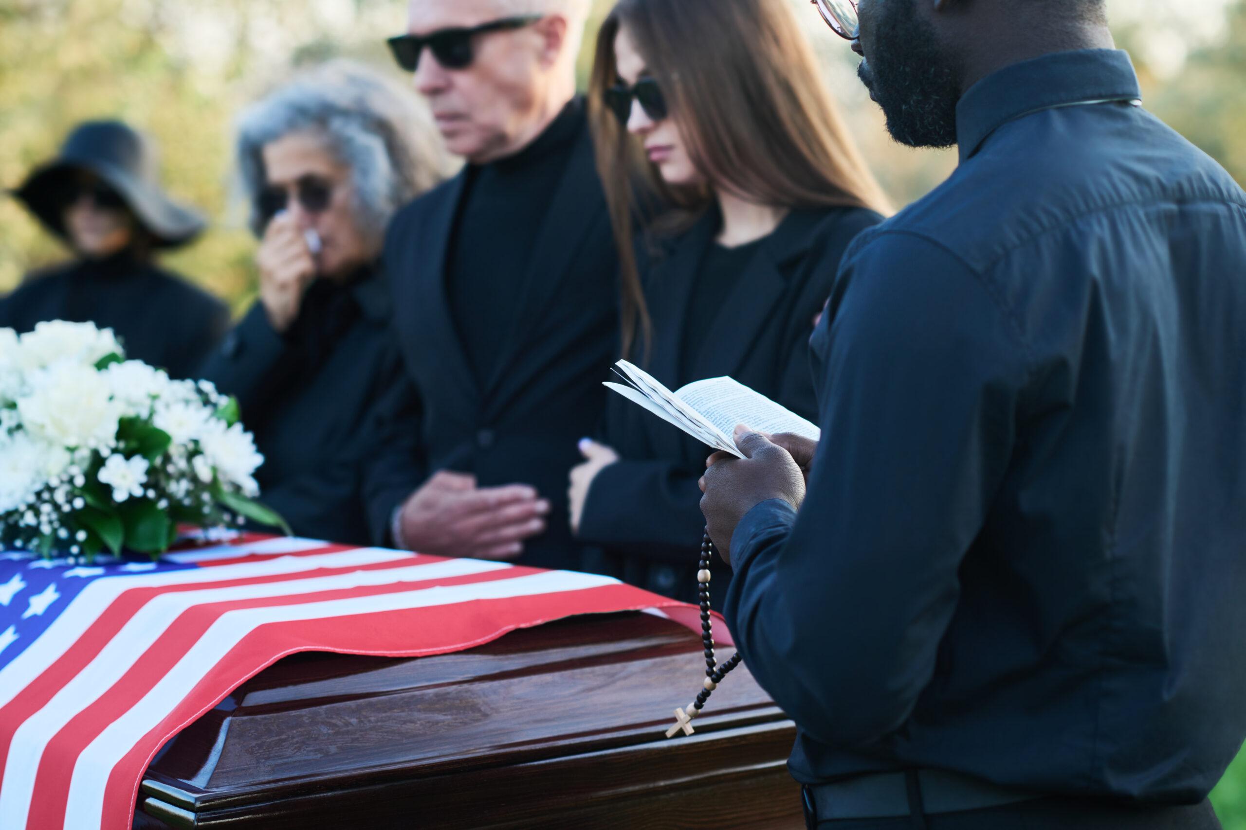 Funeral with flag over casket