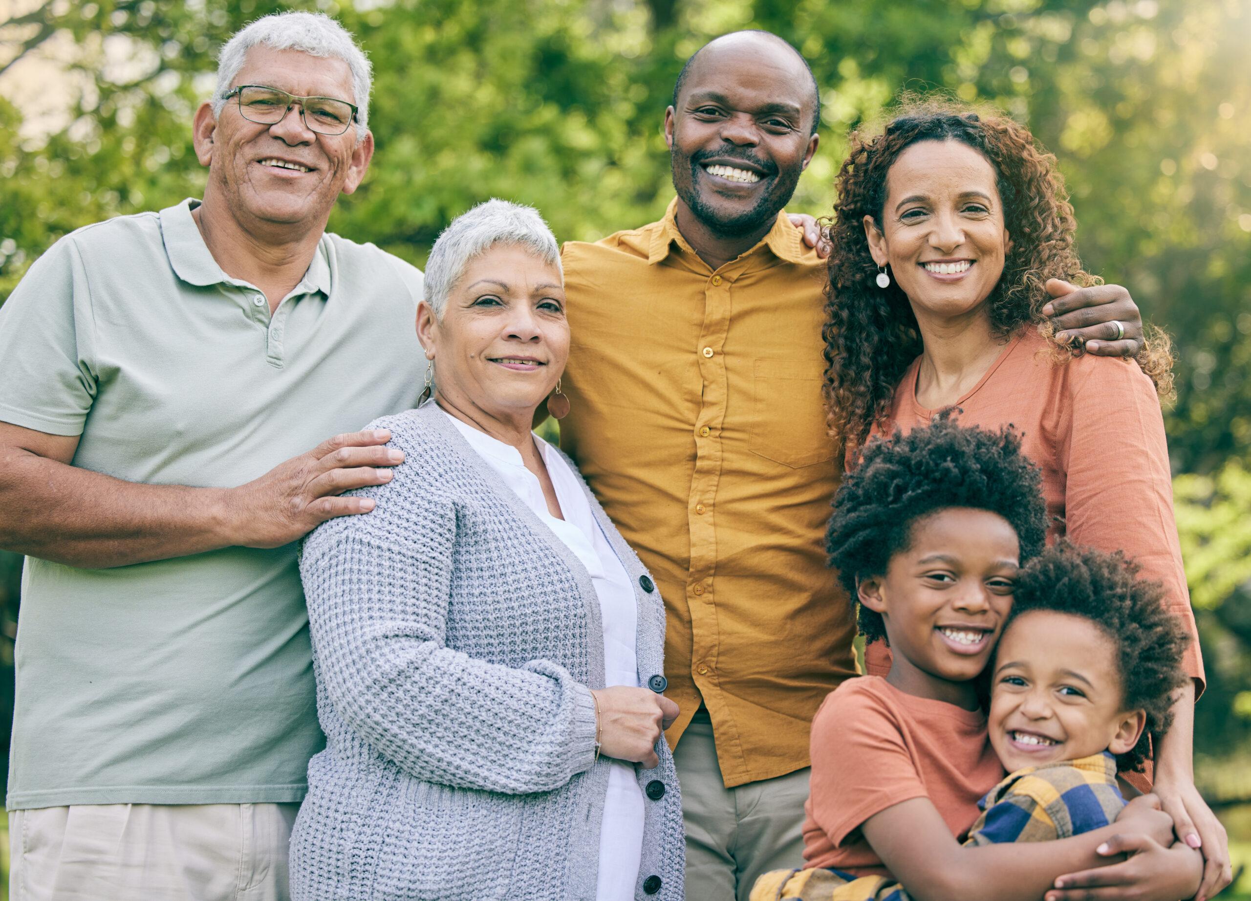 Family smiling outside