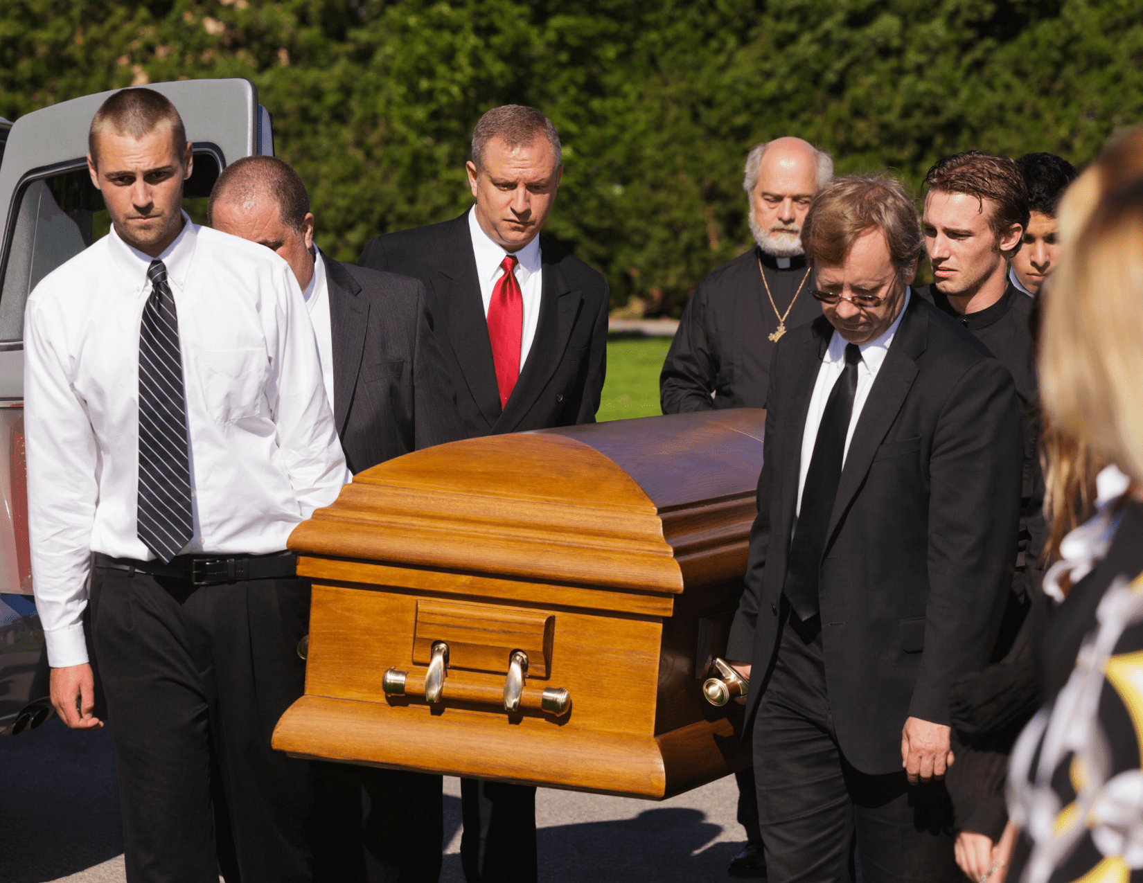 funeral etiquette and pallbearer holding casket