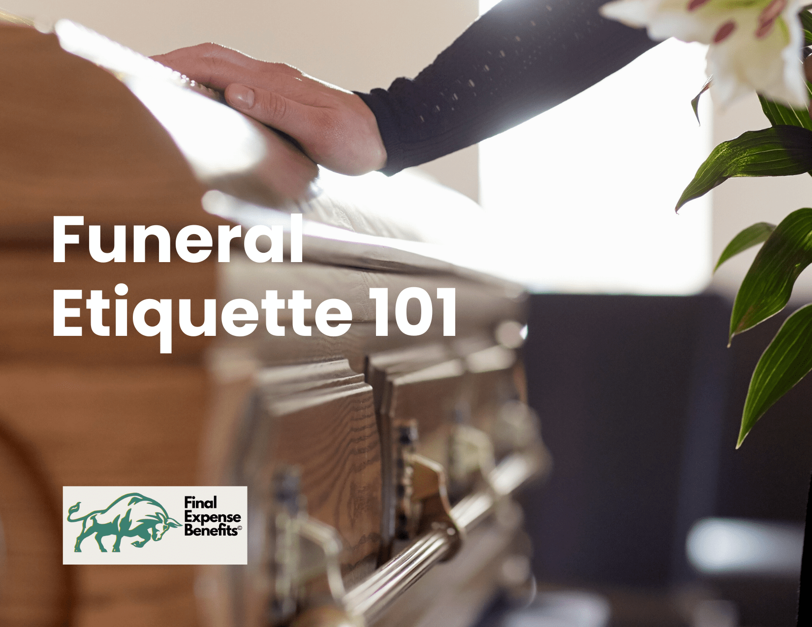 Hand on on funeral coffin with flowers