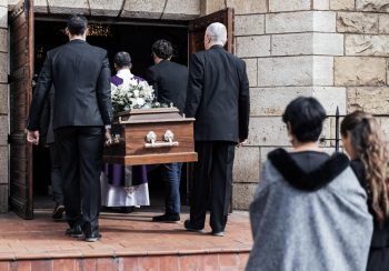 Death, funeral and people with coffin to church, chapel service and ceremony for temple ritual. RIP.