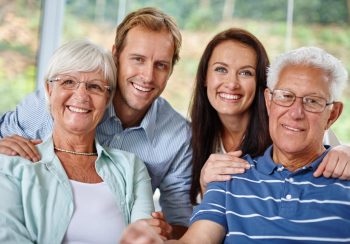 Family is like a small piece of Heaven. Portrait of a happy family of four smiling at the camera