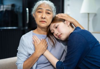 Granddaughter consoled and encouraged her grandmother with love.