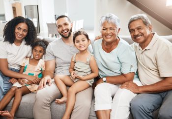 Happy family sitting on couch