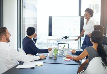 Lets review the year. Cropped shot of a businesswoman giving a presentation in the boardroom.