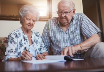 Senior couple doing retirement paperwork