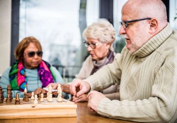 Senior adults in a nursing home for the elderly doing leisure activities